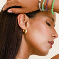 Solstice Gleam Gold Hoops 2